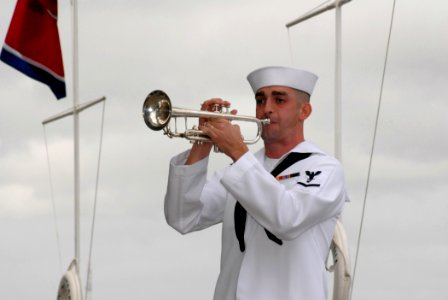 US Navy 061207-N-4965F-054 A Sailor assigned to U.S. Pacific Fleet Band sounds Taps during a joint U.S. Navy-National Park Service ceremony commemorating the 65th Anniversary of the attack on Pearl Harbor