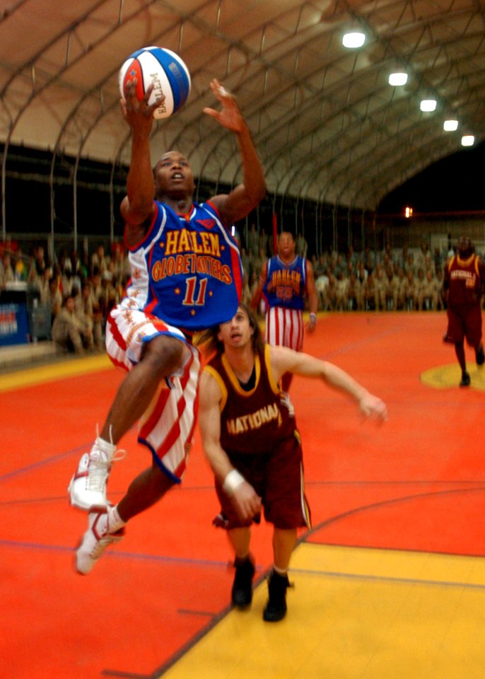 US Navy 061208-N-1328C-398 Shane Christensen, member of the Harlem Globetrotters, makes a two-point lay-up during his performance at Camp Lemonier, home of the Combined Joint Task Force-Horn of Africa (CJTF-HOA) command