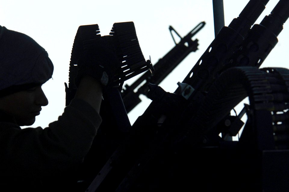 US Navy 061208-N-8148A-037 Gunner's Mate Seaman Corey Perez, from San Antonio, Texas, reloads 7.62-mm rounds after the crew of patrol craft USS Chinook (PC 9) conducts small arms qualification