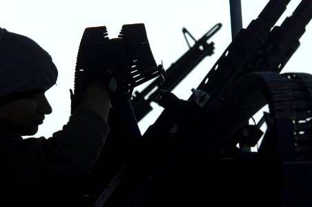 US Navy 061208-N-8148A-037 Gunner's Mate Seaman Corey Perez, from San Antonio, Texas, reloads 7.62-mm rounds after the crew of patrol craft USS Chinook (PC 9) conducts small arms qualification