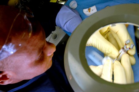 US Navy 061216-N-5345W-027 Hospital Corpsman 2nd Class Ricky Thompson crafts wax-ups for all-ceramic crowns in the dental department's prosthetics lab aboard the Nimitz-class aircraft carrier USS Harry S. Truman (CVN 75) photo