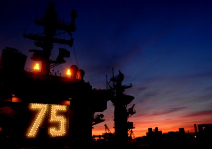 US Navy 061217-N-5345W-002 The sunsets beyond the island of the Nimitz-class aircraft carrier USS Harry S. Truman (CVN 75)