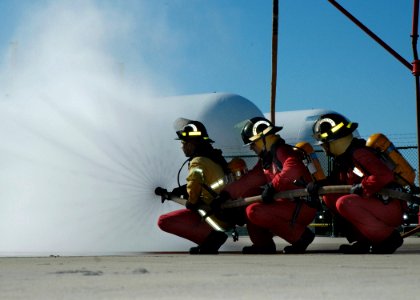 US Navy 061212-N-1522S-075 Instructors at the Center for Naval Engineering, Naval Station Mayport, demonstrate proper hose handling techniques during the Advanced Fire Fighting Course