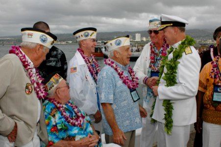 US Navy 061207-N-9076B-175 Commander U.S. Pacific Fleet Adm. Gary Roughead talks with Pearl Harbor survivors after taking part in the joint U.S. Navy-National Park Service ceremony commemorating the 65th Anniversary of the atta