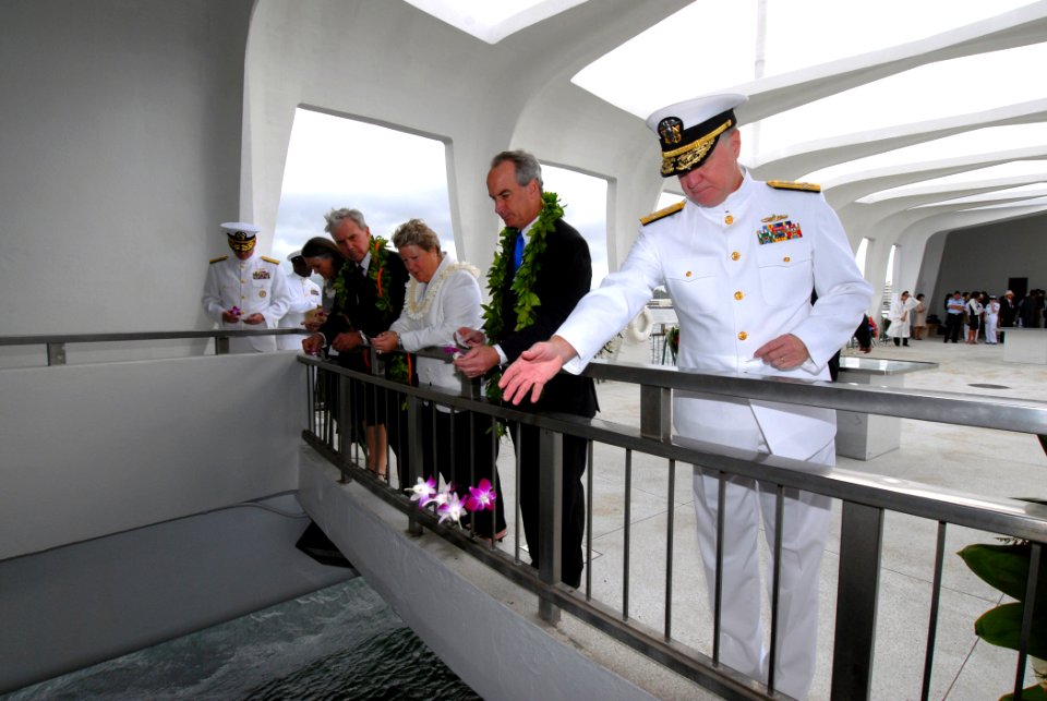 US Navy 061207-N-4965F-070 Commander, U.S. Pacific Fleet Adm. Gary Roughead, throws flower pedals into the USS Arizona Memorial well during a floral tribute at the memorial