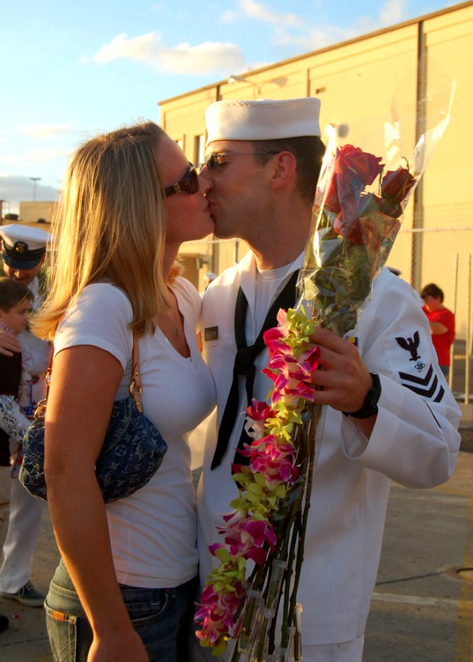 US Navy 061212-N-9486C-001 Electronics Technician 1st Class Ryan Sweetser greets his wife after fast-attack submarine USS Buffalo (SSN 715) returned from a six-month deployment to the western Pacific