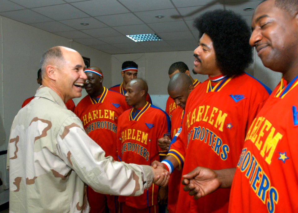 US Navy 061208-N-1328C-241 Combined Joint Task Force-Horn of Africa Commander, Rear Adm. Richard Hunt, meets with the Harlem Globetrotters, prior to their performance at Camp Lemonier, home of the Combined Joint Task Force-Horn
