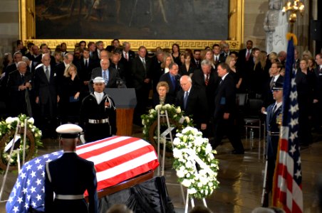 US Navy 061230-D-1142M-006 Vice President Richard B. Cheney accompanies former First Lady Betty Ford as she approaches the casket of her husband former President Gerald R. Ford