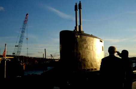 US Navy 061219-N-8467N-001 Capt. John J. Litherland, commanding officer of USS Texas (SSN 775), points out some features on the fast attack submarine to Congressman Joe Courtney