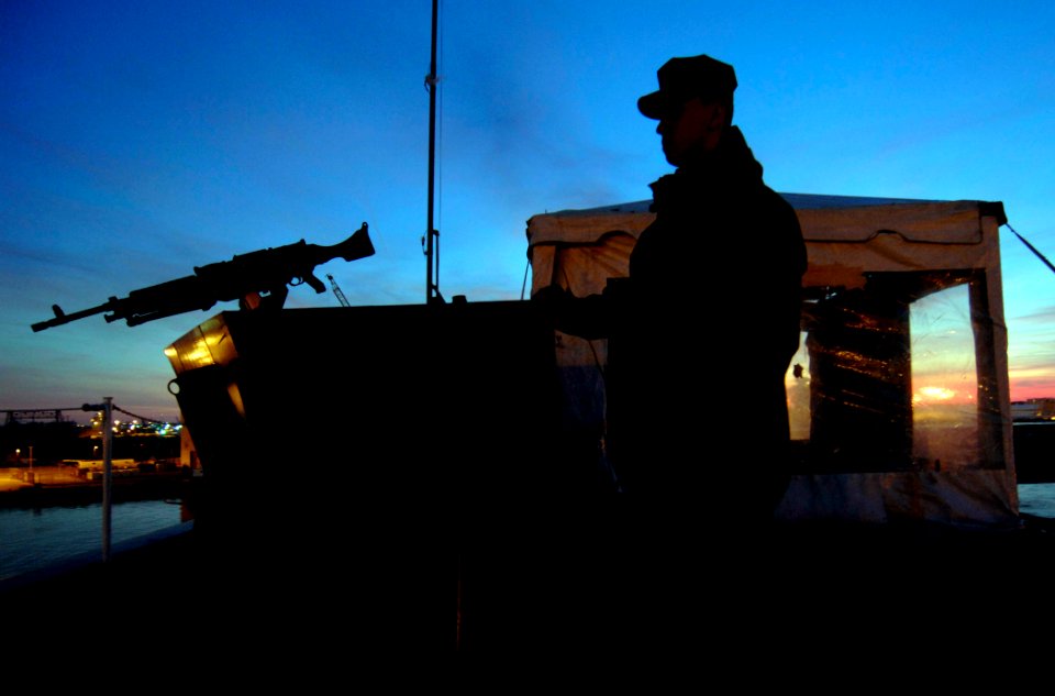 US Navy 061217-N-5345W-015 Aviation Ordnanceman Airman Josh Thomas mans a sentry post with a M-240 machine gun aboard the Nimitz-class aircraft carrier USS Harry S. Truman (CVN 75)