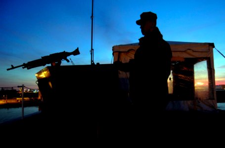 US Navy 061217-N-5345W-015 Aviation Ordnanceman Airman Josh Thomas mans a sentry post with a M-240 machine gun aboard the Nimitz-class aircraft carrier USS Harry S. Truman (CVN 75)