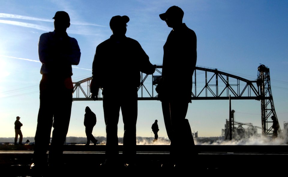 US Navy 061220-N-5345W-021 Sailors watch from the flight deck of the Nimitz-class aircraft carrier USS Harry S. Truman (CVN 75) as it gets underway from Norfolk Naval Shipyard in Portsmouth, Va