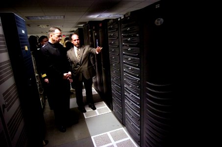 US Navy 061214-N-0696M-062 Chief of Naval Operations (CNO) Adm. Mike Mullen receives a tour from Mr. Dwayne Green, Space ^ Naval Warfare Systems Center Director of Information Technology Operations (SPAWAR) in New Orleans