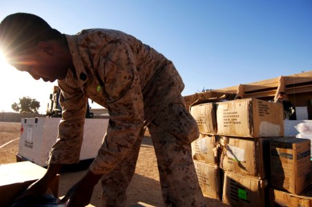US Navy 061220-N-5758H-125 Hospital Corpsman 2nd Class Enrise Scott, assigned to the 1st Medical Battalion, Camp Pendleton, unloads medical supplies