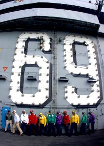 US Navy 061220-N-8907D-003 Rainbow sideboys await the arrival of distinguished visitors aboard the Nimitz-class aircraft carrier USS Dwight D. Eisenhower (CVN 69)