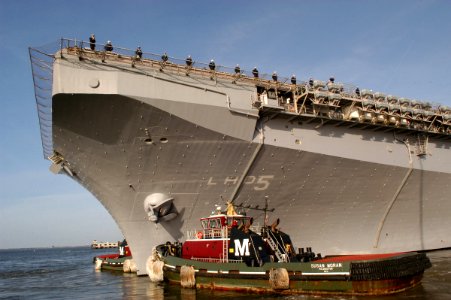 US Navy 070104-N-1713L-073 Sailors assigned to the amphibious assault ship USS Bataan (LHD 5) man the rails as the ship gets underway at Naval Station Norfolk for a regularly scheduled deployment