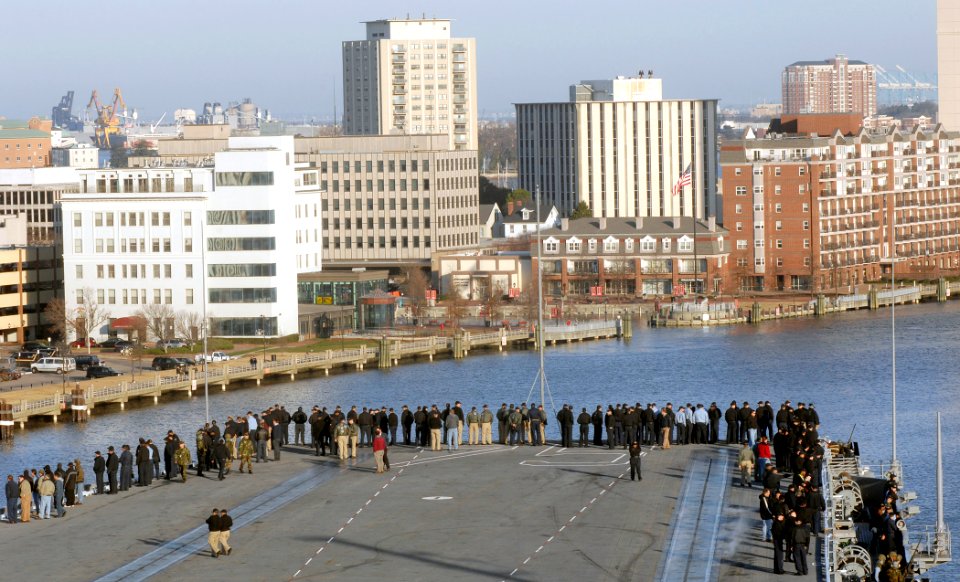 US Navy 061220-N-5345W-034 Sailors gather on the flight deck and look at downtown Portsmouth, Va., as the Nimitz-class aircraft carrier USS Harry S. Truman (CVN 75) navigates the Elizabeth River