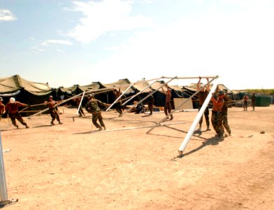 US Navy 070105-N-1226D-036 Amphibious Construction Battalion 1, Charlie, Company, set up a tension fabric structure for the Morale, Warfare and Recreation tent during Humanitarian Support Over the Shore (HSOTS) 2007
