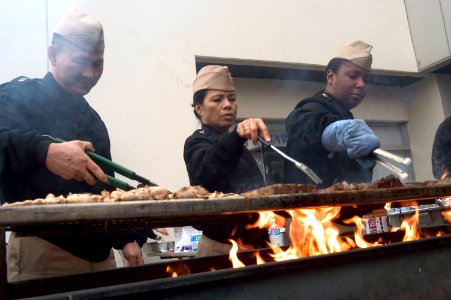 US Navy 061214-N-8534H-005 The Chief Petty Officer Association (CPOA) on board Yokosuka Naval Base cooks up and serves single Sailors and Marines a warm tasty meal for the holidays