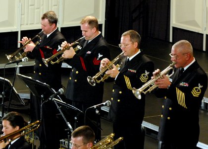US Navy 061221-N-0773H-048 The trumpet section of the U.S. Navy Band Commodores jazz ensemble perform during an evening concert at the Midwest Band and Orchestra Conference photo