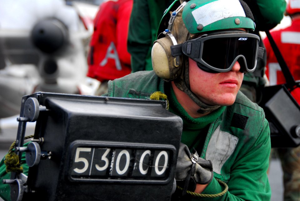 US Navy 061215-N-8158F-027 Airman Kyle Sanders confirms the weight of an F-A-18E Super Hornet prior to launch aboard the nuclear-powered aircraft carrier USS Nimitz (CVN 68)