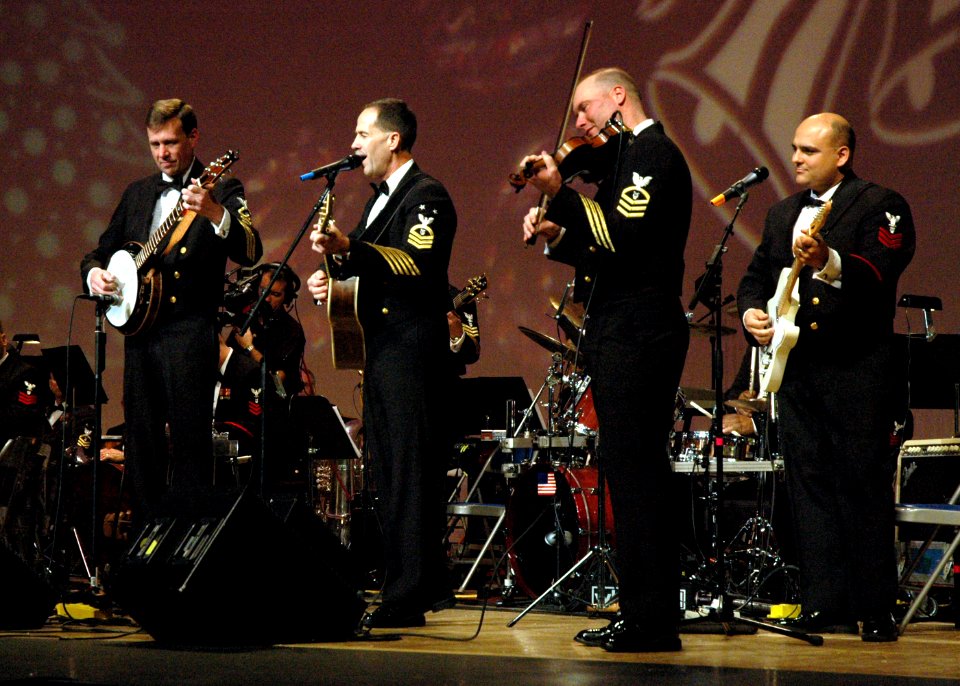 US Navy 061216-N-0773H-039 Master Chief Musician Wayne C. Taylor, leader of the U.S. Navy Band Country Current, a country-bluegrass group, sings