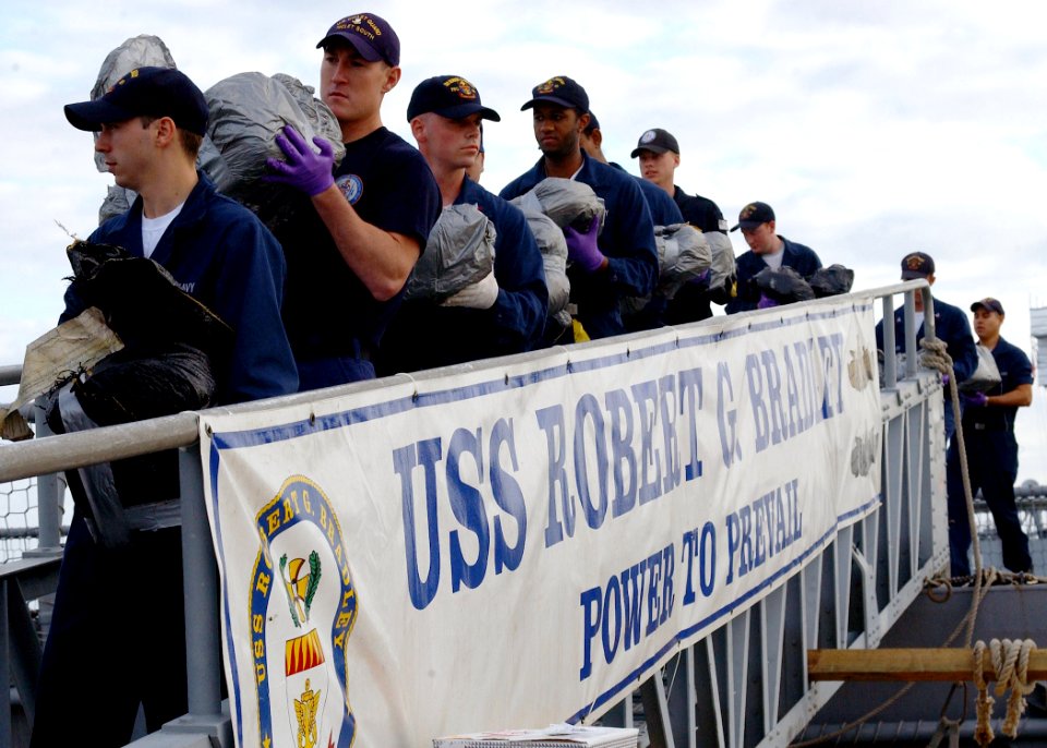 US Navy 070112-N-8544C-005 Sailors aboard the guided missile frigate USS Robert G. Bradley (FFG 49) offload 23 tons of illegal drugs seized in a multi-national and interagency effort to interdict the flow of narcotics into the