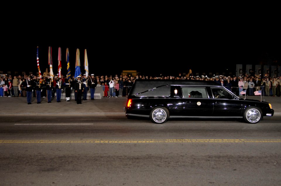 US Navy 061230-F-6875C-059 A hearse carrying the remains of former President Gerald R. Ford pauses for a moment of mutual tribute at the National World War II Memorial in Washington, D.C., Dec. 30, 2006