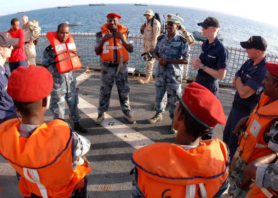 US Navy 070114-G-1330O-003 Members of the Djiboutian Navy discuss boarding tactics with the U.S. Coast Guard Cutter Midgett (WHEC 726) boarding team during a professional exchange and law enforcement tactics exercise