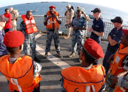 US Navy 070114-G-1330O-003 Members of the Djiboutian Navy discuss boarding tactics with the U.S. Coast Guard Cutter Midgett (WHEC 726) boarding team during a professional exchange and law enforcement tactics exercise