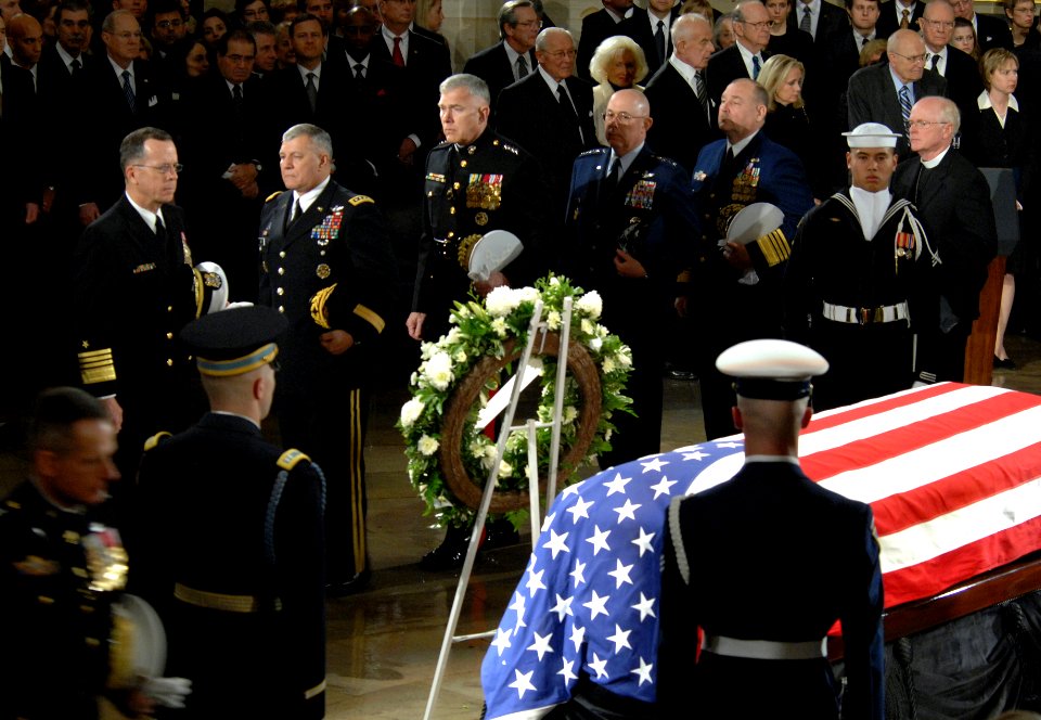 US Navy 061230-D-1142M-015 Chief of Naval Operations (CNO) Adm. Mike Mullen, far-left, accompanied by other senior military leaders, pay their respects at the conclusion of memorial services for Gerald R. Ford
