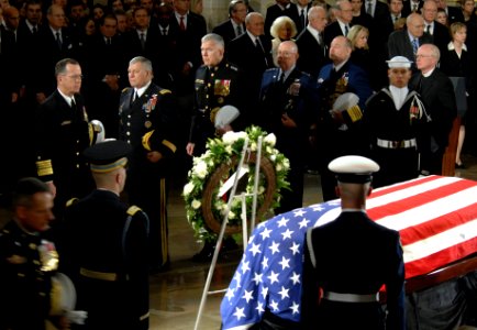 US Navy 061230-D-1142M-015 Chief of Naval Operations (CNO) Adm. Mike Mullen, far-left, accompanied by other senior military leaders, pay their respects at the conclusion of memorial services for Gerald R. Ford