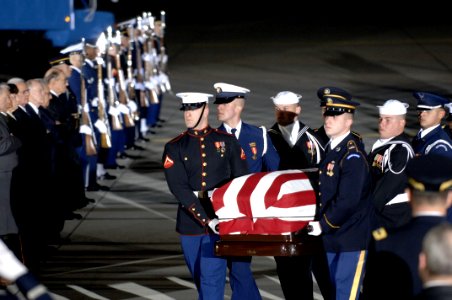 US Navy 061230-F-0194C-001 The casket of former President Gerald R. Ford, is carried by members of the U.S. Armed Forces Color Guard at Andrews Air Force Base, Md., Dec. 30, 2006