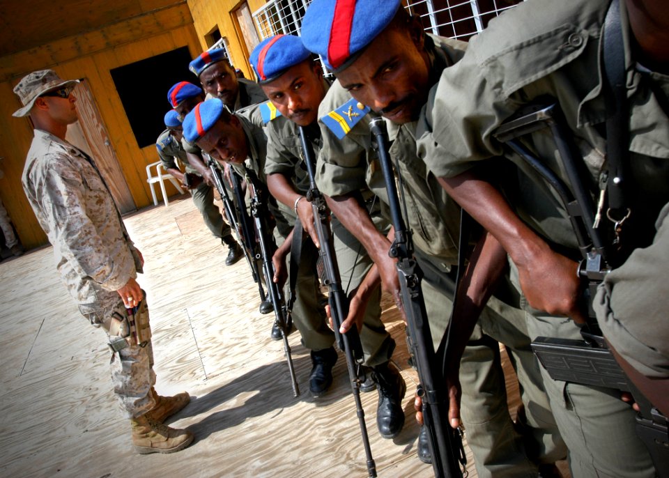 US Navy 061221-N-1328C-059 Marine Corps Sgt. Jeremy Gutierrez from Amarillo, Texas, directs students from the special brigade of the Djiboutian national police, during a three-day training on a range of topics from basic weapon