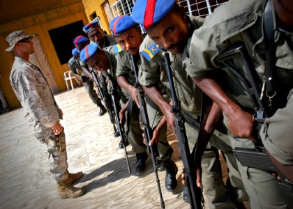 US Navy 061221-N-1328C-059 Marine Corps Sgt. Jeremy Gutierrez from Amarillo, Texas, directs students from the special brigade of the Djiboutian national police, during a three-day training on a range of topics from basic weapon