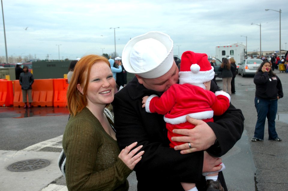 US Navy 061222-N-1127C-026 Intelligence Specialist 2nd Class Stephen Muench cries while holding his child for the first time