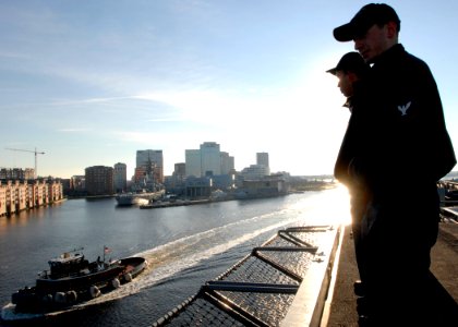 US Navy 061220-N-5345W-055 Sailors look out over the Norfolk, Va. Waterside district as the Nimitz-class aircraft carrier USS Harry S. Truman (CVN 75) navigates the Elizabeth River