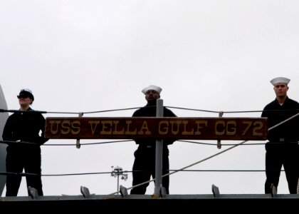 US Navy 070105-N-1713L-045 Sailors aboard the guided missile cruiser USS Vella Gulf (CG 72) man the rails as the ship get underway from Naval Station Norfolk photo
