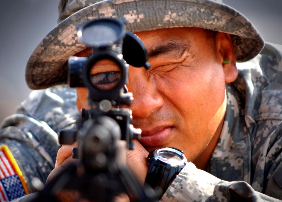 US Navy 061223-N-1328C-253 Army Sgt. Mijung Kim, from Harmon, Guam, uses a rifle scope to line up a target 300 meters away during joint training with the Marine Corps 5th Provisional Security Company
