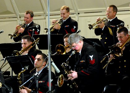 US Navy 061221-N-0773H-038 Musician 1st Class Robert A. Holmes assigned to the U.S. Navy Band Commodores jazz ensemble solos on baritone saxophone during an evening concert at the Midwest Band and Orchestra Conference