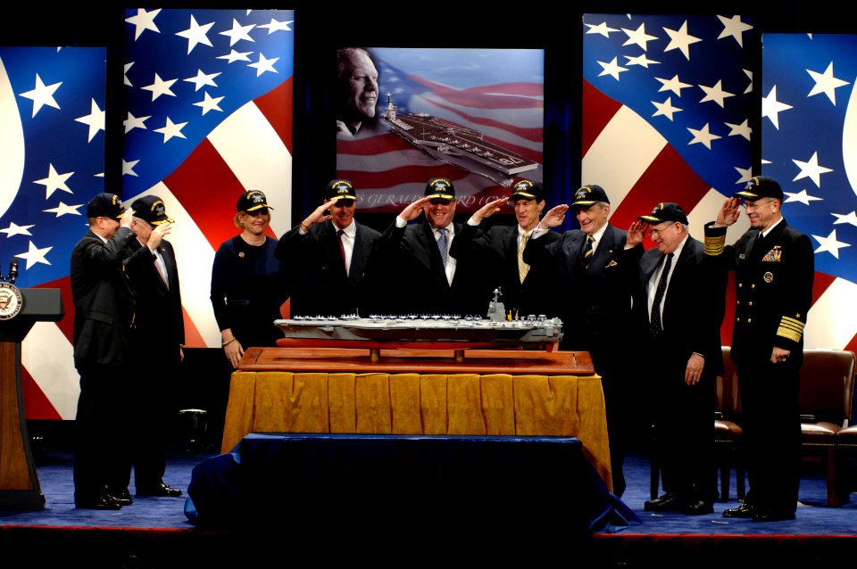 US Navy 070116-N-3642E-171 SECNAV Dr. Donald C. Winter, Vice President Dick Cheney, Susan Ford Bales, Jack Ford, Mike Ford, Steve Ford, Sen. John Warner, Sen. Carl Levin and CNO Adm. Mike Mullen salute as the model of USS Geral