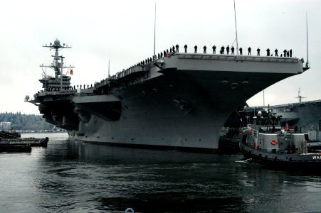 US Navy 070116-N-7656R-003 Sailors man the rails as the Nimitz-class aircraft carrier pulled out of Naval Base Kitsap, Bremerton for their scheduled deployment