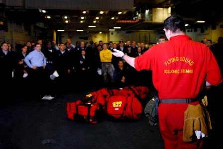 US Navy 070117-N-0684R-006 Damage Controlman 2nd Class Timothy Roney teaches new Sailors about fire fighting equipment aboard the Nimitz-Class aircraft carrier USS John C. Stennis (CVN 74)