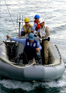 US Navy 061222-N-5330L-074 Sailors assigned to the guided-missile cruiser USS Anzio (CG 68) patrol in a Rigid Hull Inflatable Boat as Anzio pulls into port at United Arab Emirates
