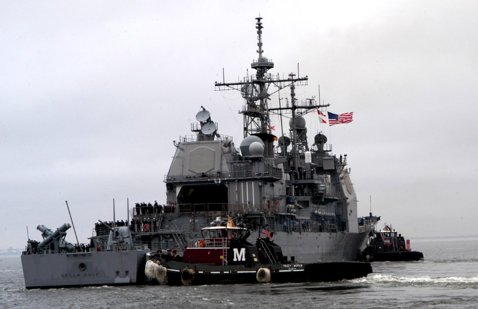 US Navy 070105-N-1713L-061 Tugboats escort the guided missile cruiser USS Vella Gulf (CG 72) as it departs Naval Station Norfolk