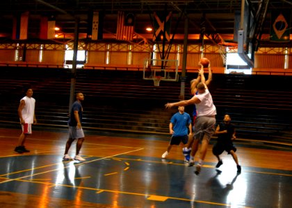 US Navy 070117-N-4965F-003 Chief Information Systems Technician Eddie Granger assigned to the Oliver Hazard Perry-class guided missile frigate USS Crommelin (FFG 37), drives toward the net to score a basket during a three-on-th