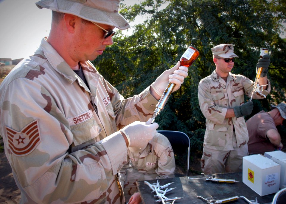 US Navy 070109-N-1328C-218 Tech. Sgt. Chris Shetterly, from Olympia, Wash., and other veterinarians and medical personnel prepare medications for a Veterinarian Civil Action Program (VETCAP)