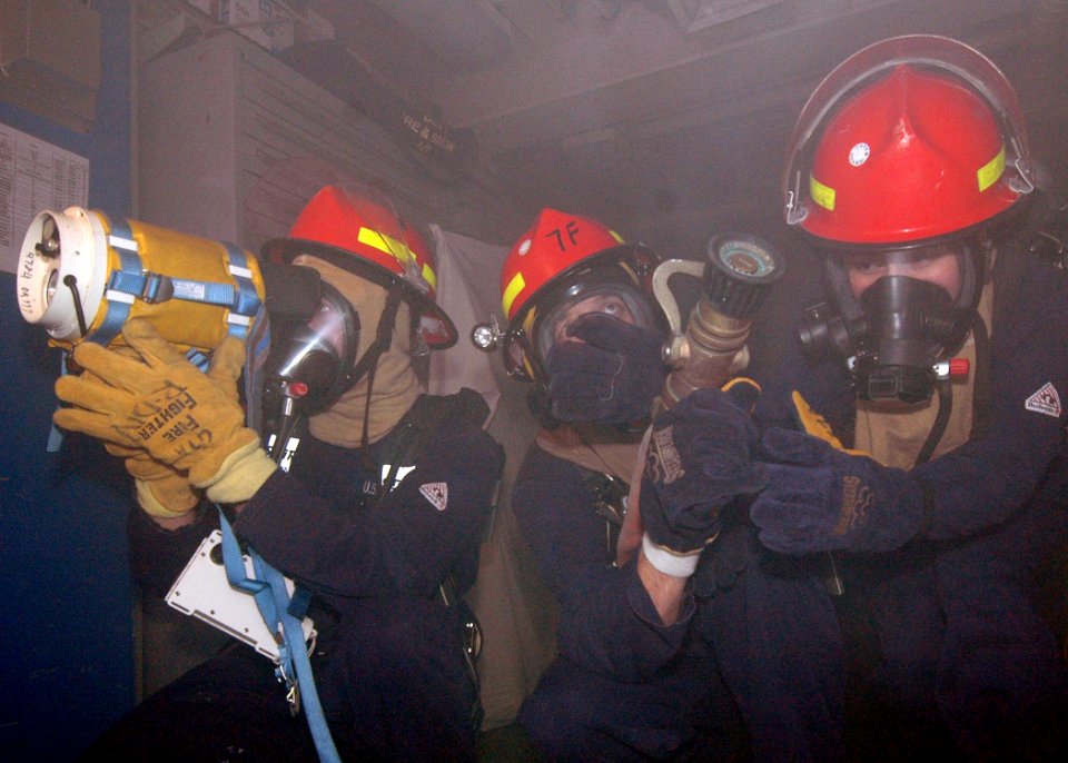 US Navy 070111-N-0209M-002 Sailors investigate a space using a Navy Firefighting Thermal Imager (NFTI) during a fire drill, aboard amphibious assault ship USS Boxer (LHD 4)