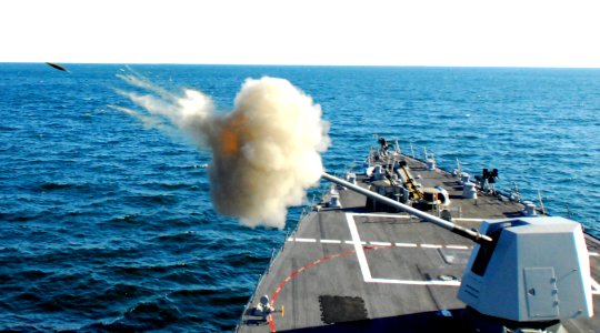 US Navy 070111-N-4515N-429 Guided missile destroyer USS Forest Sherman (DDG 98) test fires its five-inch gun on the bow of the ship during training