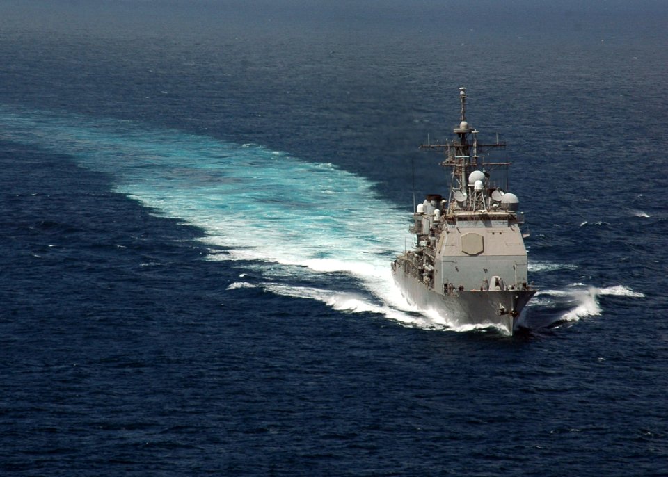 US Navy 070112-N-0490C-004 The Ticonderoga-class guided-missile cruiser USS Bunker Hill (CG 52) steams ahead after completing a Fueling at Sea (FAS) with the Nimitz-class aircraft carrier USS Dwight D. Eisenhower (CVN 69)